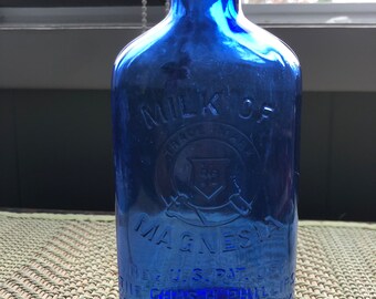 Cobalt blue Vintage Milk of magnesia medicine bottle in perfect cond