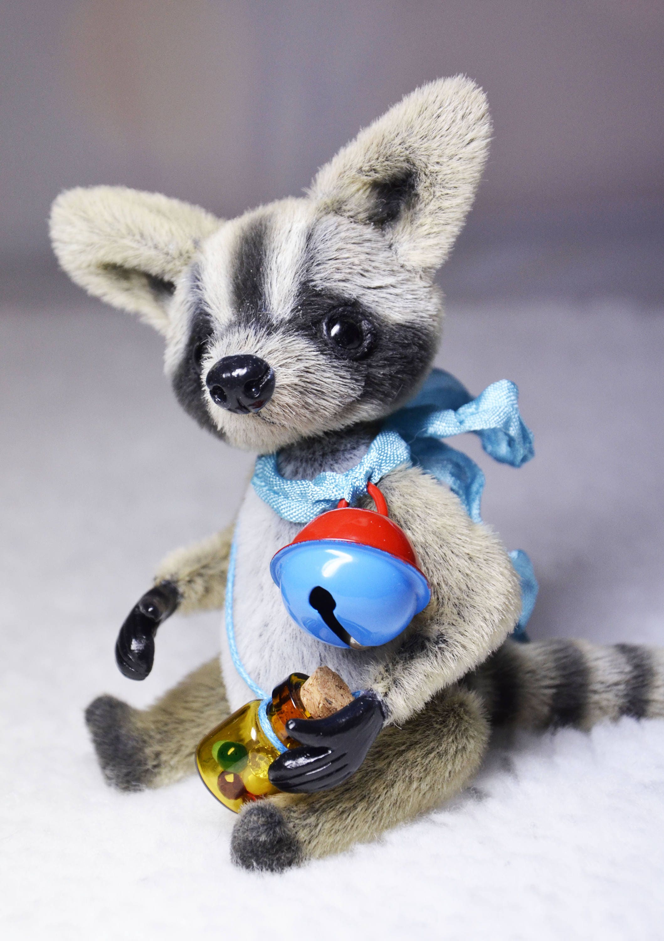 raccoon with stuffed raccoon