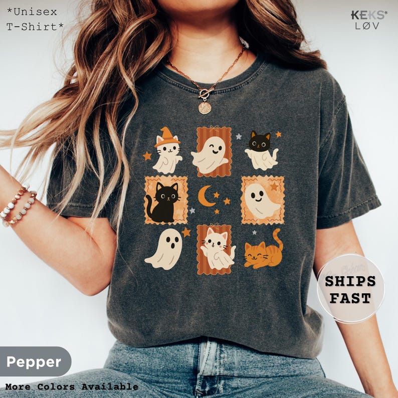 unisex t-shirt with retro Halloween design featuring cute black cats, orange cats, and friendly ghosts in vintage postcard style