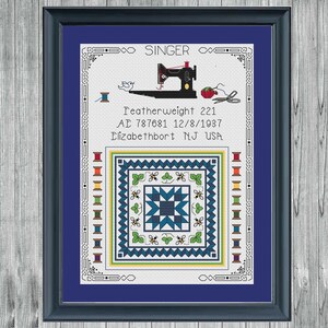 May include: Framed cross-stitch art featuring a black Singer sewing machine, spools of thread, and a quilt block design in blue, green, and white. Text includes "Featherweight 221" and "Elizabethport NJ USA".