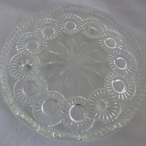 Vintage Pressed Glass Footed Round Clear Serving Cake Plate 9.25 in D – Decorative Roundels & Central Star Burst – three foot base supports