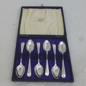 May include: Set of six silver teaspoons in a blue velvet lined box. The box is labelled "Roberts & Son Ltd. Sheffield".