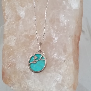 Silver and turquoise dainty pendant with organic flower design. Slim silver chain. Boxed