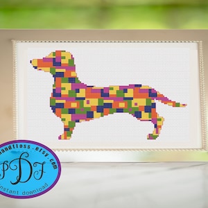 May include: A colorful cross-stitch pattern of a dachshund dog. The dog is made up of a variety of squares in different colors, including yellow, orange, green, purple, and blue.