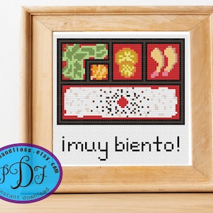 May include: Cross stitch pattern of a Japanese bento box with the text "I'm very bento!" in a white frame.