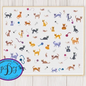 Op de afbeelding: Een kruissteekpatroon met verschillende kleurrijke katten in verschillende poses, die spelen met garen, vis en muizen. Het patroon is op een witte achtergrond.