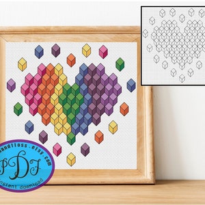 Könnte beinhalten: Ein gerahmtes Kreuzstichmuster mit einem Herzdesign aus farbenfrohen, dreidimensionalen Würfeln in einem Regenbogenverlauf. Das Kunstwerk enthält eine kleinere Schwarz-Weiß-Version des Herzens und den Text "stitchandfloss.etsy.com".