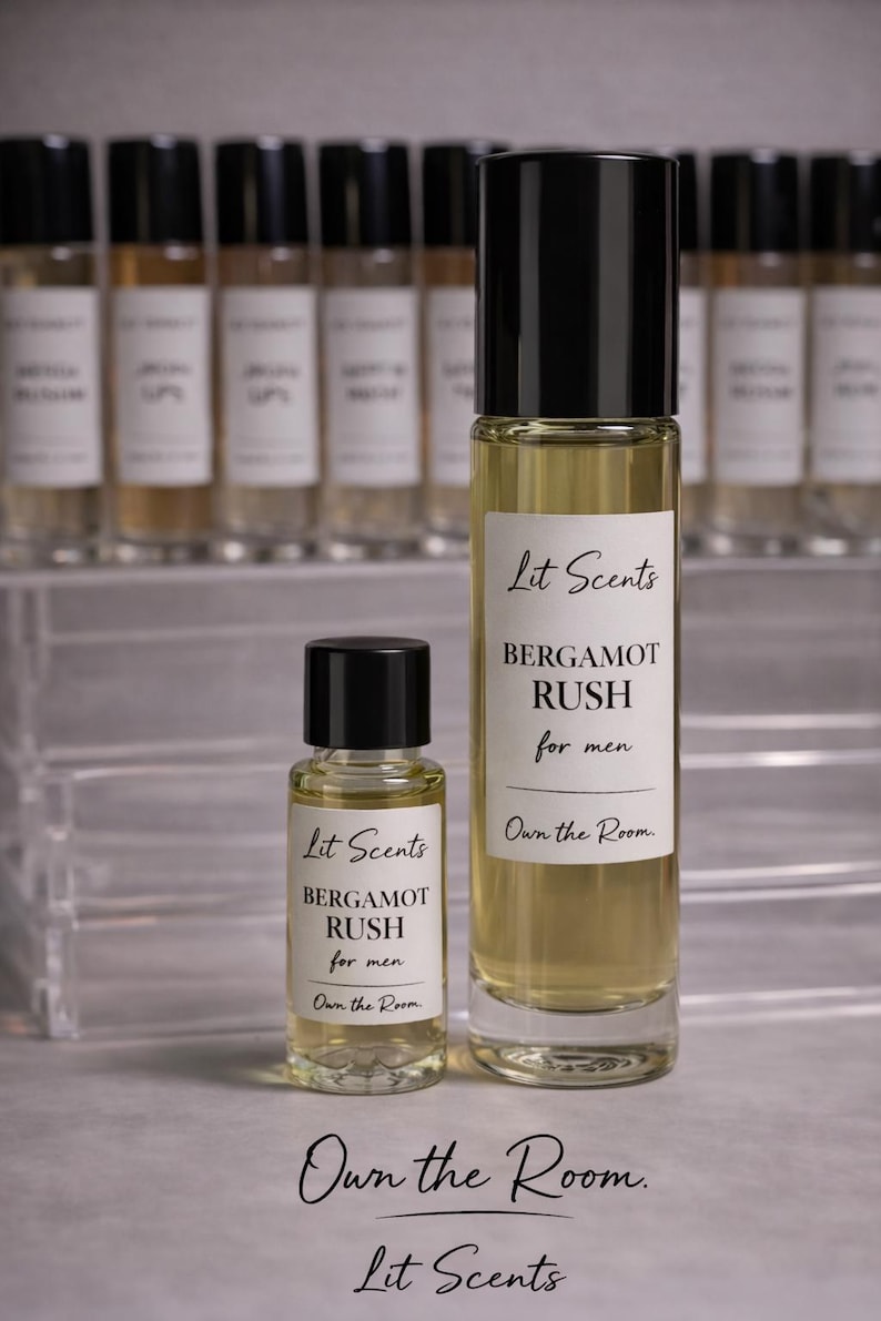 May include: Two glass perfume bottles with black caps, one large and one small, labeled "Lit Scents BERGAMOT RUSH for men." The background features a row of similar bottles. The text "Own the Room" is also visible.