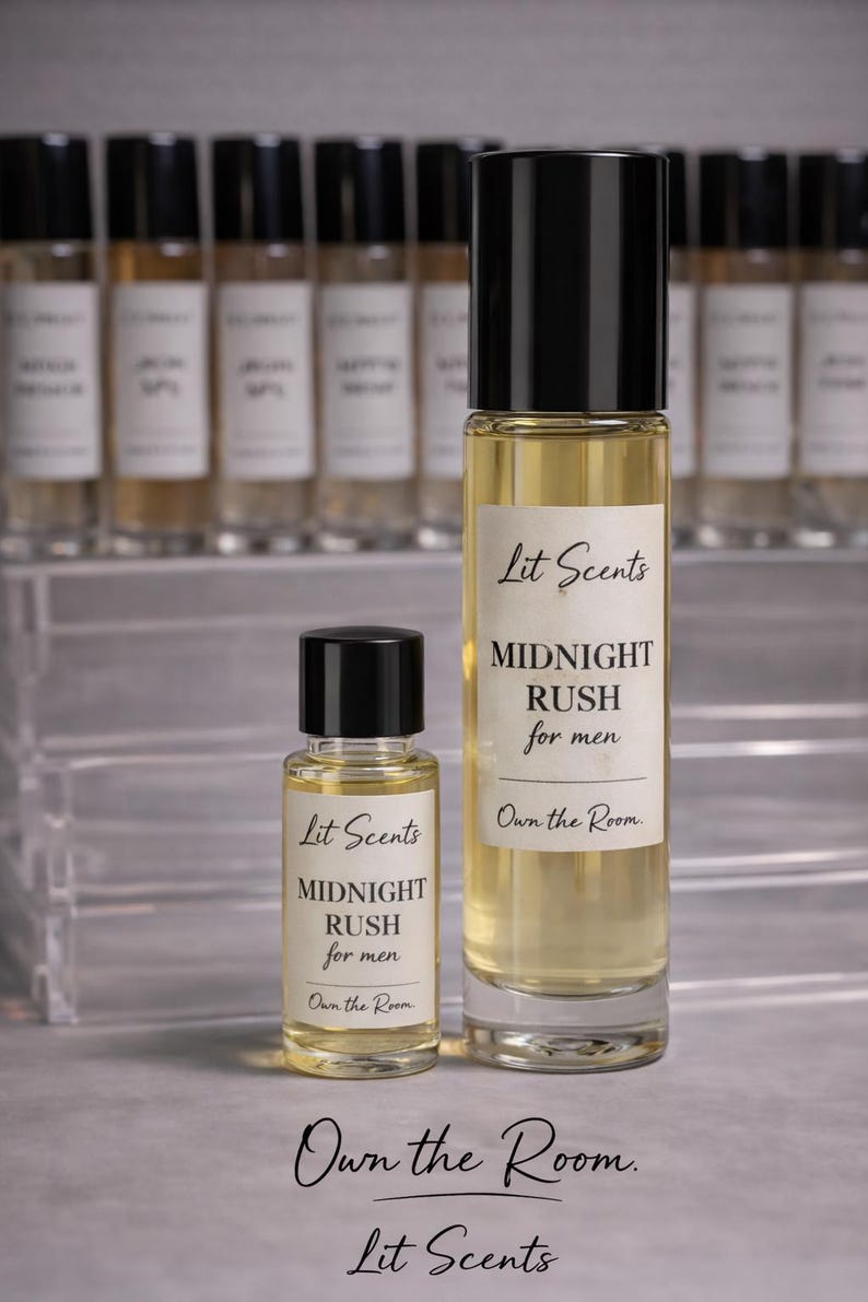 May include: Two bottles of "Midnight Rush for men" fragrance by Lit Scents. The larger bottle is tall and slender, with a black cap and a white label. The smaller bottle has a similar design. The background features additional bottles.