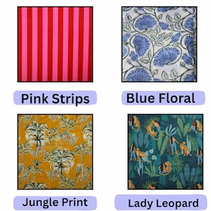 May include: Four fabric swatches: one with vertical pink and red stripes, one with blue floral patterns on white, one with a yellow jungle print featuring giraffes and palm trees, and one with a dark green print of leopards and figures.