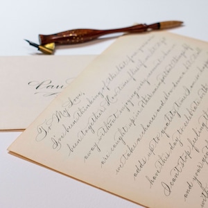 Custom love letter handwritten in calligraphy on vintage paper.