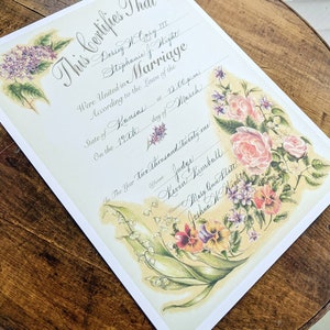 Vintage floral marriage certificate with calligraphy written in the blank lines.