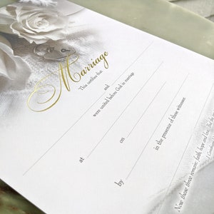 Example of white rose marriage certificate with blank lines for wedding information.