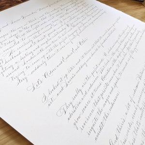 Wedding ceremony script in custom calligraphy black ink on white paper.