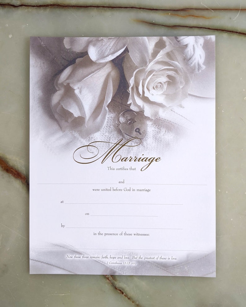 Example of white rose marriage certificate with blank lines for wedding information.