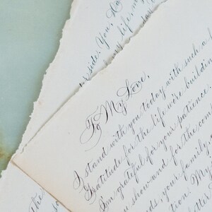 Marriage proposal love letter with custom calligraphy on vintage paper.