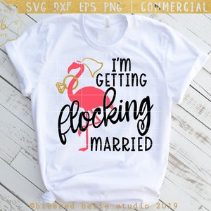 May include: White t-shirt featuring a pink flamingo wearing a veil and holding a ring. The text "I'm getting flocking married" is printed on the shirt.