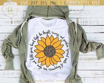 May include: A white t-shirt with a yellow sunflower graphic and the text "Hold your head high. Be bright, sunny, and positive. Spread  says of happiness" around the sunflower.