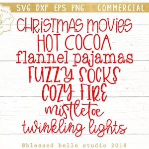May include: Red text on a white wood background reads "CHRISTMAS Movies HOT COCOA flannel pajamas FUZZY SOCKS COZY FIRE mistletoe twinkling lights @blessed belle studio 2018"