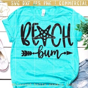 May include: A turquoise t-shirt with a black graphic design that says "BEACH bum" with a starfish and an arrow pointing to the right.