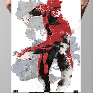 May include: A red and black illustration of Daredevil, a superhero, in a fighting pose against a white background with gray and black splatters of paint.