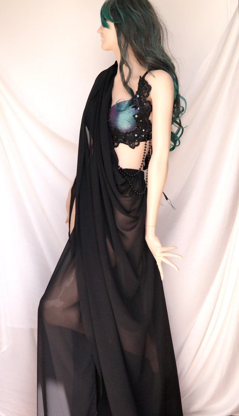 May include: A black sheer saree with a beaded and lace top. The top has a iridescent fabric with black lace and beads.