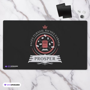 May include: Black gaming mousepad with a red and gray emblem featuring a book, chains, and the text "Pages Turned, Riches Earned" and "Prosper".
