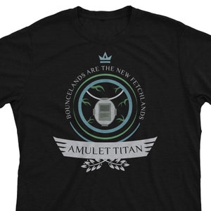 May include: Black t-shirt with a white graphic design featuring a crown, a circle with the text "Bounce lands are the new fetch lands", and the text "Amulet Titan".
