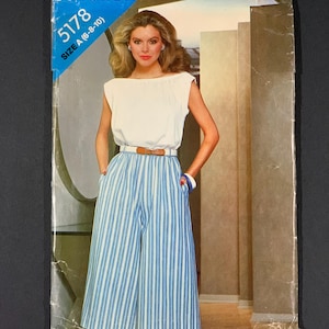 May include: Vintage sewing pattern from See & Sew, featuring a woman modeling a white top and blue and white striped culottes. The pattern number is 5178, size A (6-8-10). The cover has a blue and white banner.
