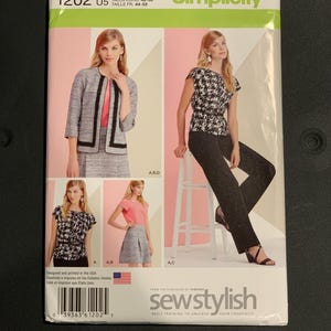 May include: A Simplicity 1202 sewing pattern envelope featuring illustrations of clothing options including a jacket, a houndstooth print top, a solid pink top, a skirt, and trousers. The text includes size U.S. 16-24, Talla Euro 42-50, and Taille FR 44-52.