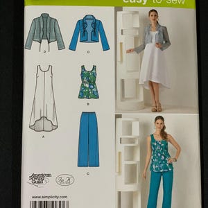 May include: Simplicity sewing pattern 1621 A, featuring illustrations of women's clothing designs. The pattern includes a jacket, dress, top, and pants. The package is white with green and blue accents and includes the text "easy-to-sew".