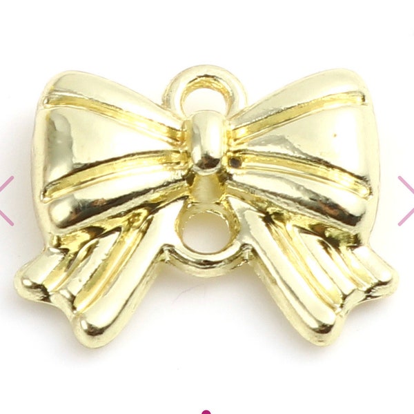 Gold colored Bow Charms Knot Set of 5 Size is 16mm x 13mm.