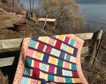 Throw quilt, handmade bedding, modern, cotton, original design, unique, coral, purple, multi-colour, featured in,