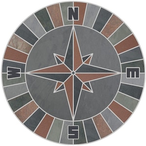 May include: A circular compass design made of slate tiles in shades of gray, brown, and green. The compass points are marked with the letters N, S, E, and W.