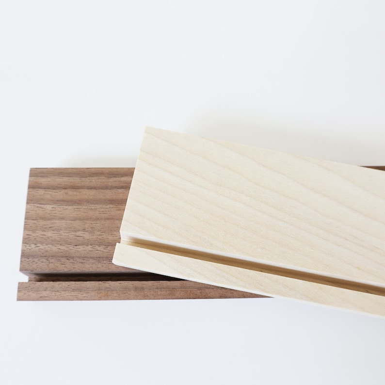 This image shows two wood stand options, walnut and blonde.