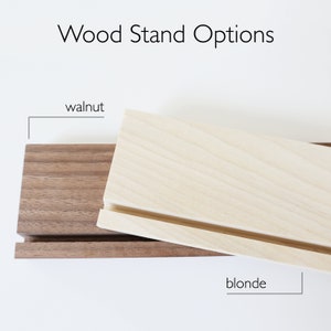 This image shows wood stand options. There are walnut and blonde options.