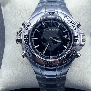 Skull Candy MP3 Player watch.  Analog with metal band.