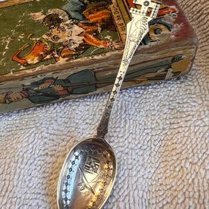 Adorable Sterling Silver collectors Spoon-Navajo whirring logs and bow and arrow.