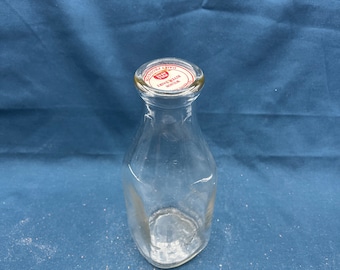 Old one quart glass milk bottle with Wilson River Dairy cap on top.  Free Shipping