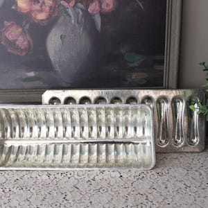 May include: A rustic wooden sign with the text "Welcome to our home" in white lettering. The sign features a distressed finish and a simple, inviting design, perfect for a front porch or entryway.