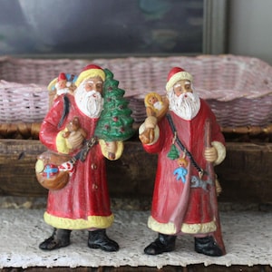 Two Vintage Plastic Santa Figurines