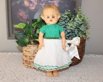 Muñeca de goma vintage sin marca, con sonido, de 26,7 cm (10,5 pulgadas), ojos verde avellana.