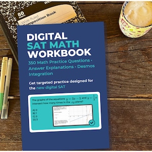 May include: A blue "DIGITAL SAT MATH WORKBOOK" with 350 math practice questions, answer explanations, and Desmos integration. The workbook is next to a composition book, two pens, and a mug of coffee on a wooden surface.
