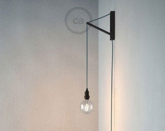 Adjustable wall mounting system in black painted wood for portable lamp