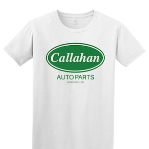 May include: White t-shirt with a green oval logo that says "Callahan Auto Parts Sandusky, OH".