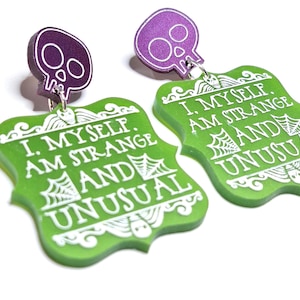 Metallic Green Beetlejuice-Inspired &#39;Strange and Unusual&#39; Quote on a Metallic Purple Skull Stud, Retro Movie, Beetlejuice, Spooky, Whimsical