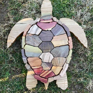 Handmade sea turtle design from mixed woods.