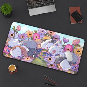 May include: A colourful mouse mat with a whimsical design featuring a group of mice sleeping amongst pink, purple and blue flowers. The design includes blueberries and a mouse mat with the text "Ballerina Art".