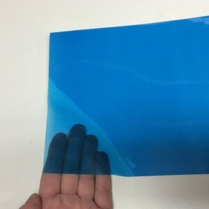 Rolls of Transparent Colored Plastic , Adhesive Coated Royal Blue