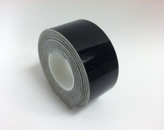 May include: A roll of black vinyl tape with a glossy finish.
